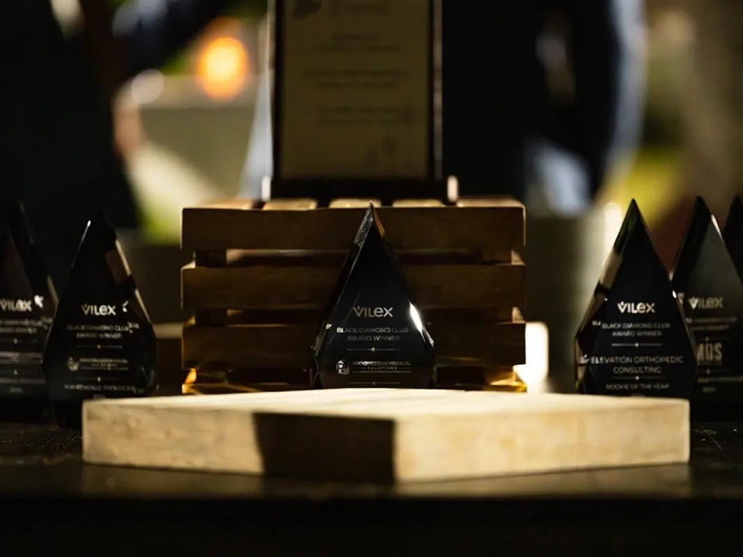 The 2024 Black Diamond Club award trophies on the presentation table.